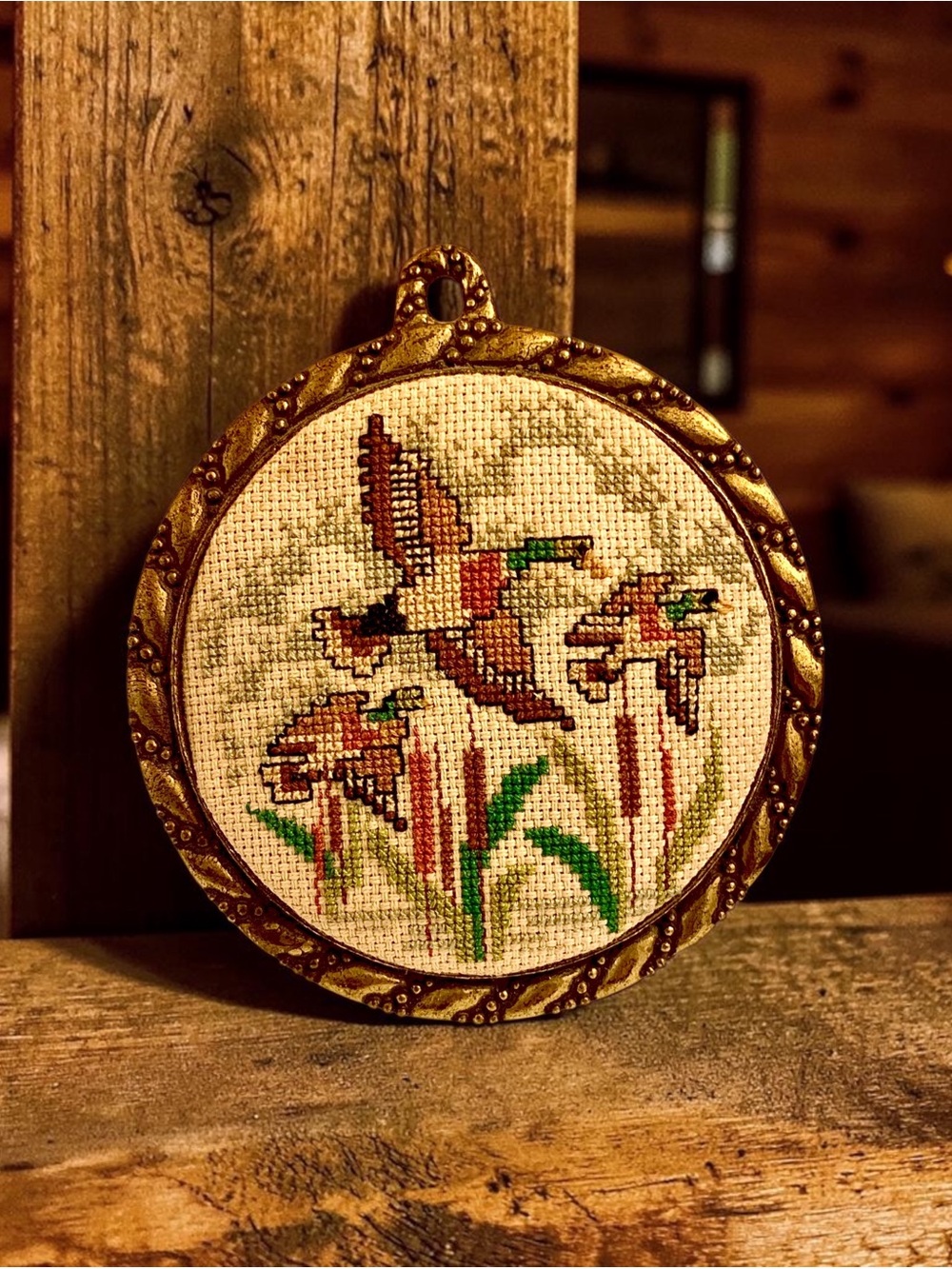 Rustic cabin art -  Completed 1982 cross stitch in ornate gold frame